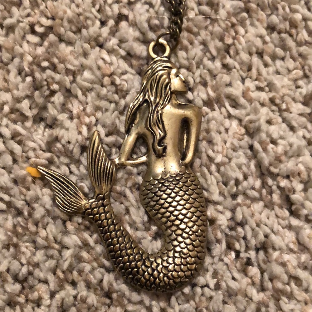 Gold tone mermaid necklace